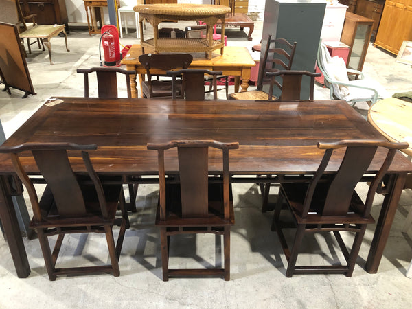 Large six seater dark wooden dining table and chairs