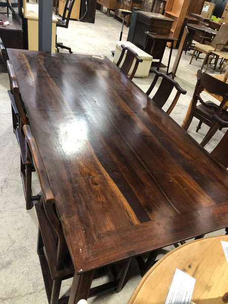 Large six seater dark wooden dining table and chairs