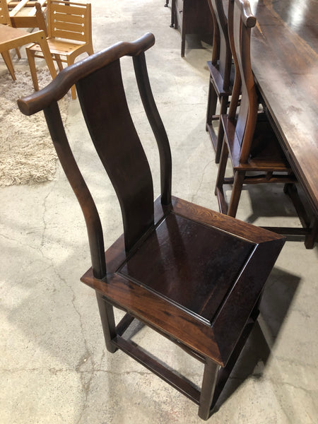 Large six seater dark wooden dining table and chairs